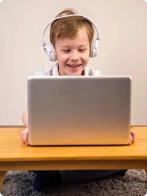 smiley-boy-playing-video-game 1